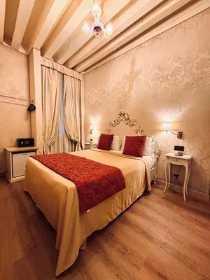 Letto o letti in una camera di Hotel al Graspo de Ua