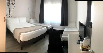 Letto o letti in una camera di Hotel Nuova Mestre