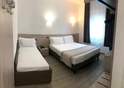 Letto o letti in una camera di Hotel Nuova Mestre