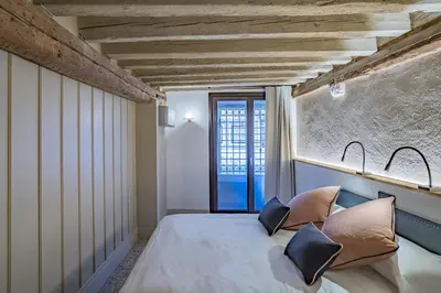 Letto o letti in una camera di Corte Rubbi 5514 Canal View