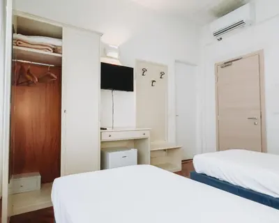 Letto o letti in una camera di Hotel all'Oasi