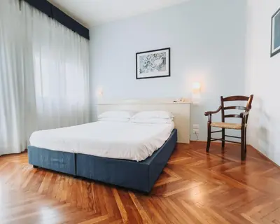 Letto o letti in una camera di Hotel all'Oasi