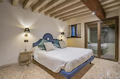 Letto o letti in una camera di Corte Rubbi 1 A True Canal-side Experience