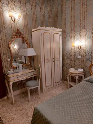 Letto o letti in una camera di Residenza Hotel San Maurizio