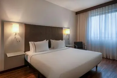 Letto o letti in una camera di AC Hotel Padova by Marriott