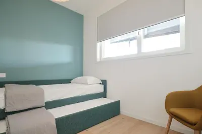 Letto o letti in una camera di Podium - QUI VENDE Immobiliare - per solo Famiglie