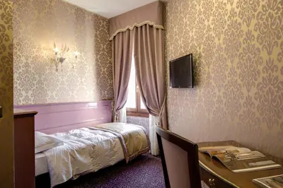 Letto o letti in una camera di Domus Cavanis