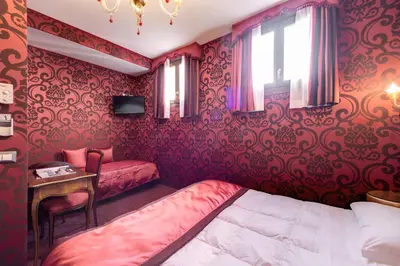 Letto o letti in una camera di Domus Cavanis