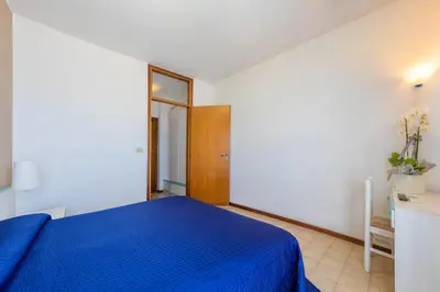 Letto o letti in una camera di Hotel Sanremo