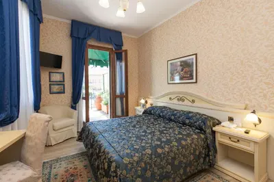Letto o letti in una camera di Hotel Riviera Venezia Lido