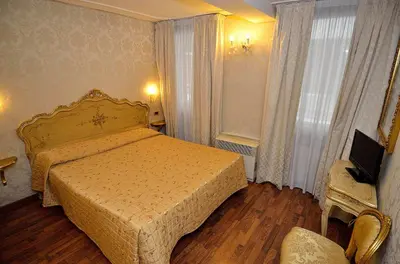Letto o letti in una camera di Hotel Noemi