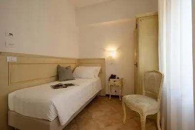 Letto o letti in una camera di Hotel Guerrini