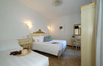 Letto o letti in una camera di Hotel Guerrini