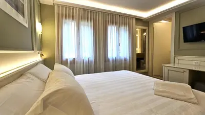 Letto o letti in una camera di Hotel Guerrini