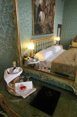 Letto o letti in una camera di Hotel Palazzo Abadessa