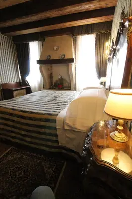 Letto o letti in una camera di Hotel Palazzo Abadessa