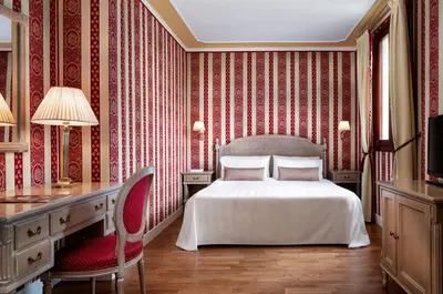 Letto o letti in una camera di Sina Palazzo Sant'Angelo