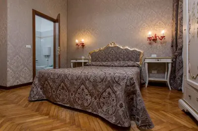 Letto o letti in una camera di Hotel Mezzo Pozzo