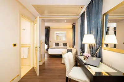 Letto o letti in una camera di Hotel A La Commedia