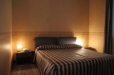 Letto o letti in una camera di Albergo Ristorante Leon d'Oro