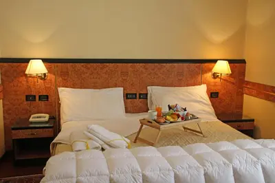 Letto o letti in una camera di Park Hotel Villa Leon d'Oro