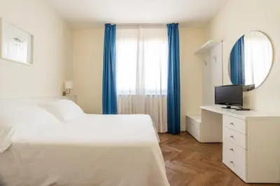 Letto o letti in una camera di Residence Atlantico