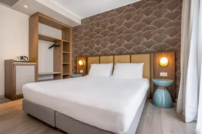 Letto o letti in una camera di Hotel Diana