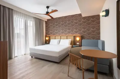 Letto o letti in una camera di Hotel Diana