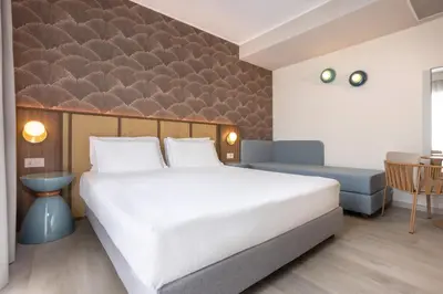 Letto o letti in una camera di Hotel Diana
