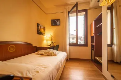 Letto o letti in una camera di Hotel Alla Torre