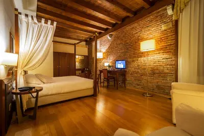 Letto o letti in una camera di Hotel Alla Torre