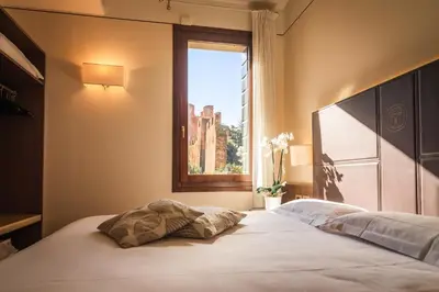 Letto o letti in una camera di Hotel Alla Torre