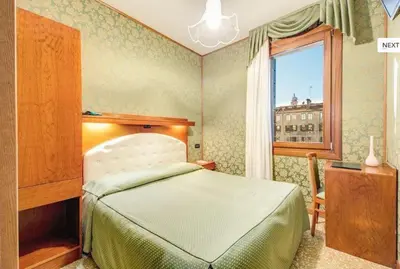 Letto o letti in una camera di Atlantide Hotel