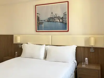 Letto o letti in una camera di Hotel Il Moro di Venezia