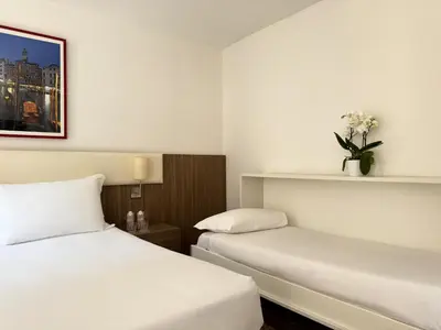 Letto o letti in una camera di Hotel Il Moro di Venezia