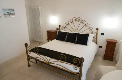 Letto o letti in una camera di B&B Marostica
