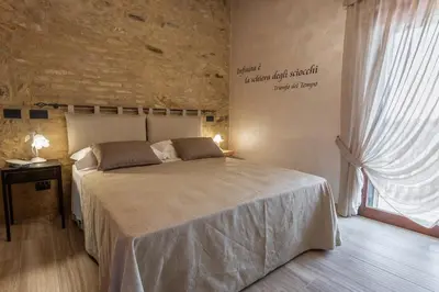 Letto o letti in una camera di Borgo Petrarca