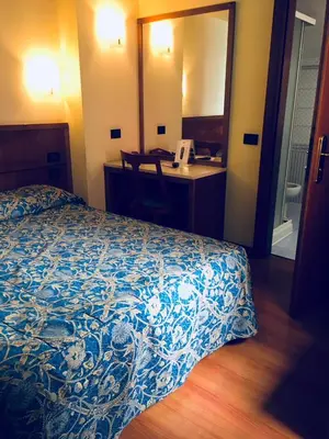 Letto o letti in una camera di Hotel Ducale