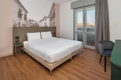 Letto o letti in una camera di B&B HOTEL Treviso Al Fogher