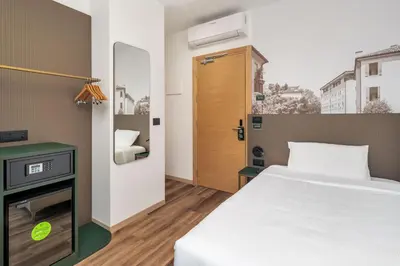 Letto o letti in una camera di B&B HOTEL Treviso Al Fogher
