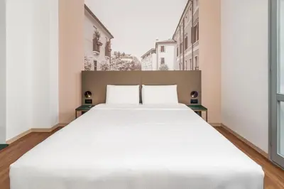 Letto o letti in una camera di B&B HOTEL Treviso Al Fogher