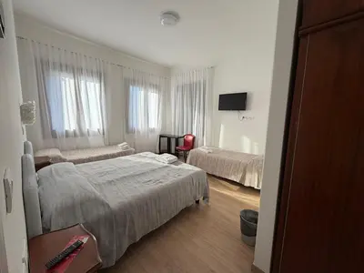 Letto o letti in una camera di Hotel Cristallo