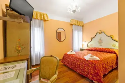 Letto o letti in una camera di Hotel Malibran