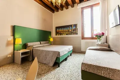 Letto o letti in una camera di Foresteria Levi
