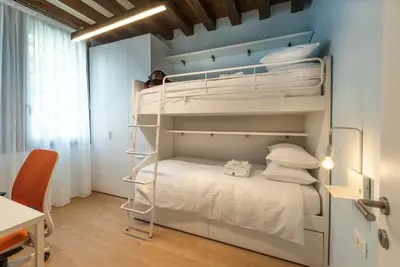 Letto o letti in una camera di Villa Gallo 1915, luxurious villa with garden and SPA