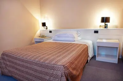 Letto o letti in una camera di Hotel Giovanni