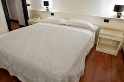 Letto o letti in una camera di Hotel Giovanni