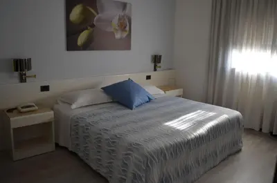 Letto o letti in una camera di Hotel Giovanni