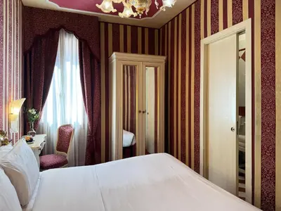 Letto o letti in una camera di Hotel Alcyone