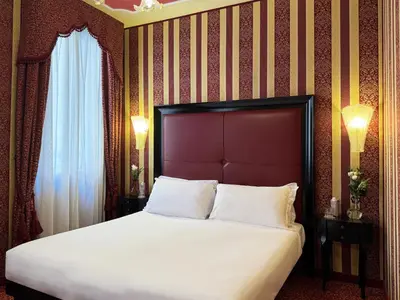 Letto o letti in una camera di Hotel Alcyone